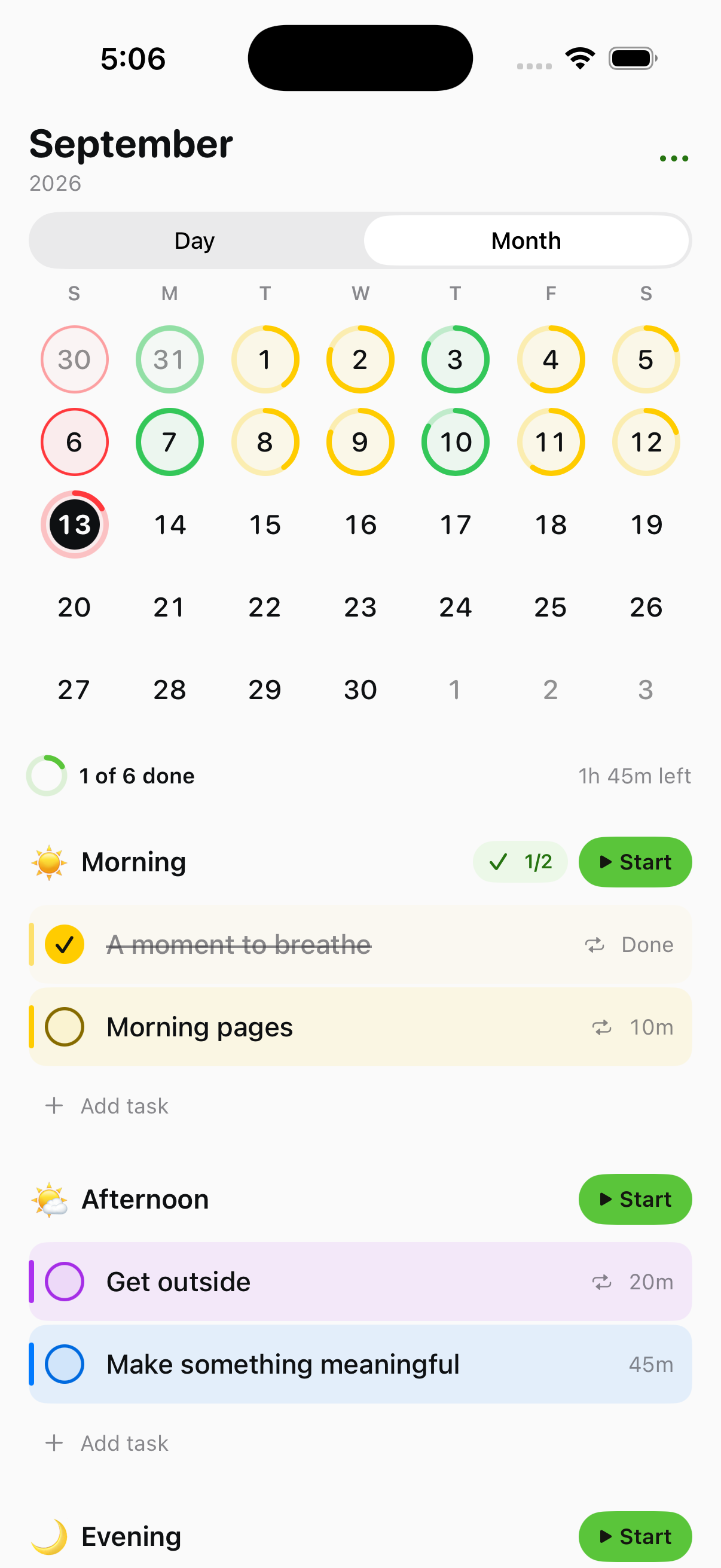 Tempo month calendar with red, yellow and green completion rings.